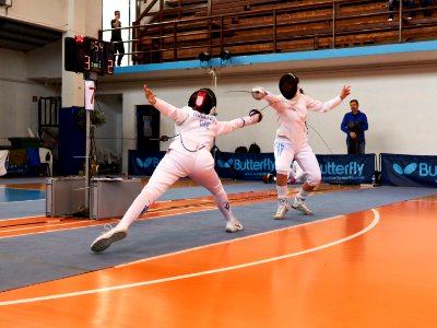 2nd_Leonidas_Pirgos_Fencing_Tournament._Evrikidi_Koletsou_performs_a_lunge_and_scores_a_touch photo