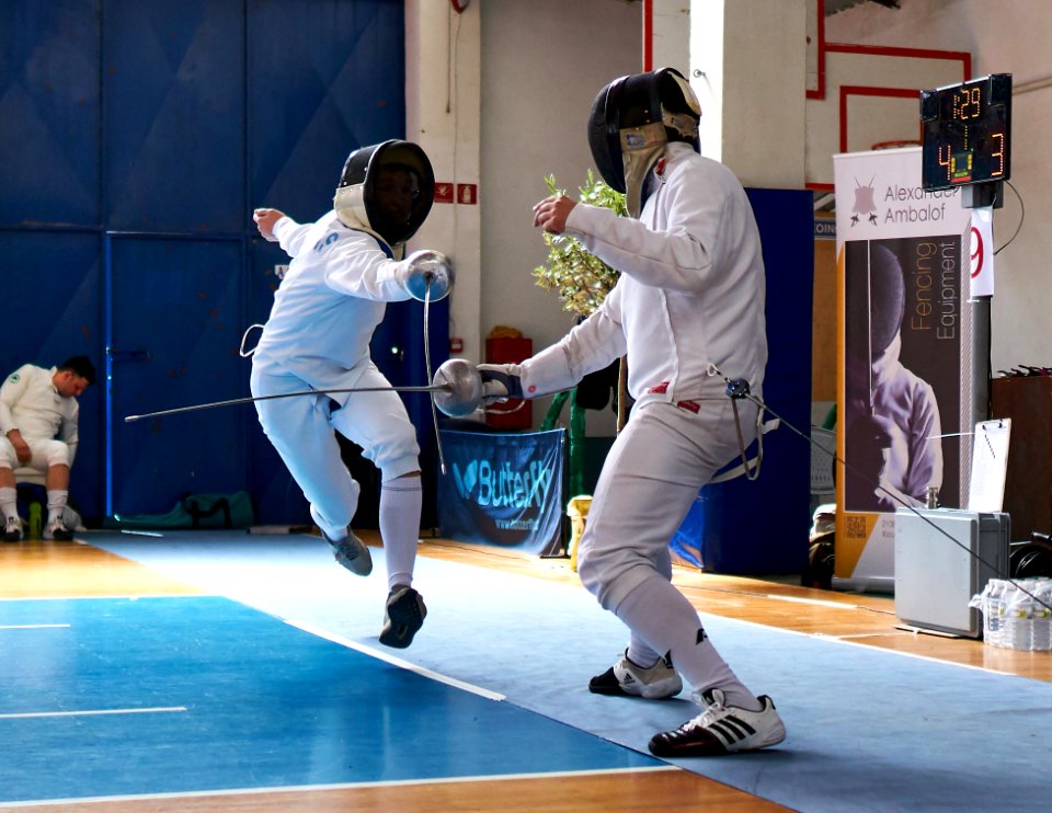 2nd_Leonidas_Pirgos_Fencing_Tournament._Flèche_performed_by_the_fencer_on_the_left_and_4th_parry_performed_by_the_fencer_on_the_right