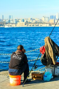 Fisherman fishing rod marine photo