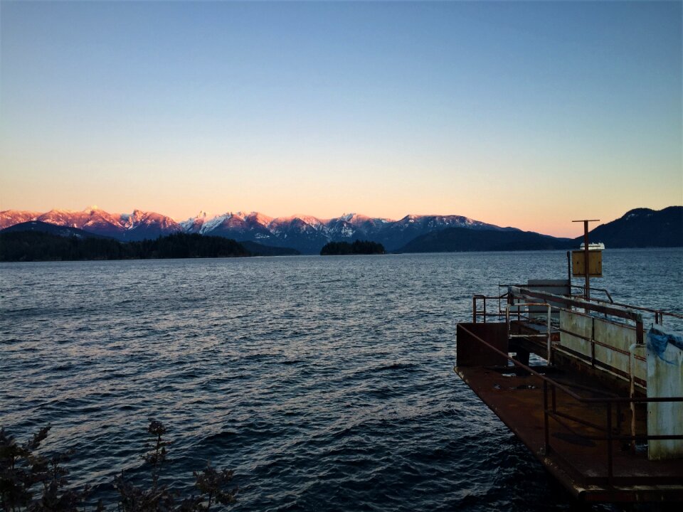 Mountain sunset rusty dock ocean sunset