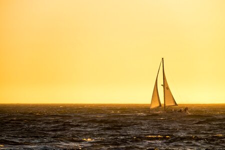 Sailing boat sunset last light photo
