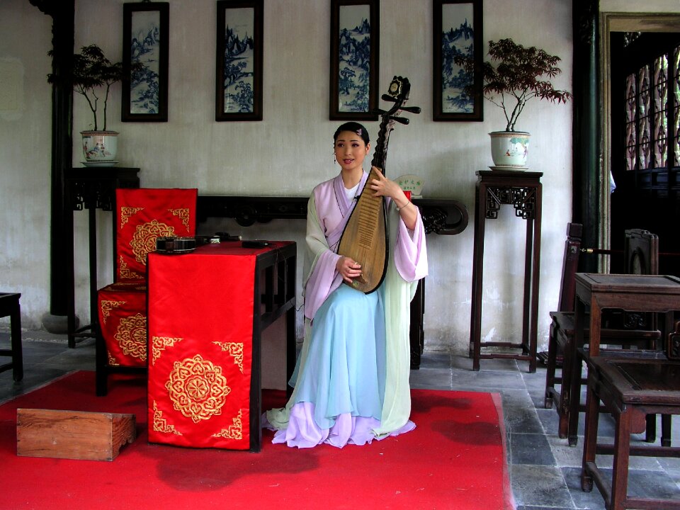 Asian woman rest musical instrument