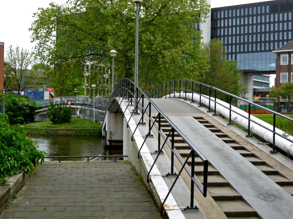 A_view_over_foot_and_bicycle_bridge_to_the_university_area_Roeterseiland,_Amsterdam;_high_resolution_image_by_FotoDutch_in_June_2013