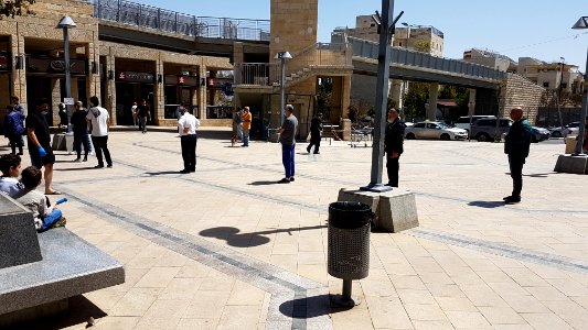 A_queue_of_people_applying_physical_social_distancing_outside_of_a_supermarket_in_Jerusalem photo
