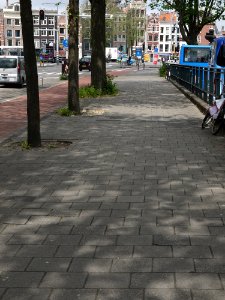 A_picture_of_shadows_of_trees_on_the_pavement_of_the_Prins_Hendrikkade;_high_resolution_image_of_FotoDutch_in_June_2013 photo