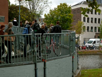 A_photo_of_students_walking_over_the_bridge_on_the_campus_Roeterseiland,_Amsterdam;_high_resolution_image_by_FotoDutch_in_June_2013 photo