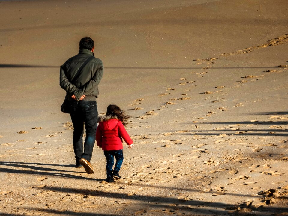 Daughter shadows sand