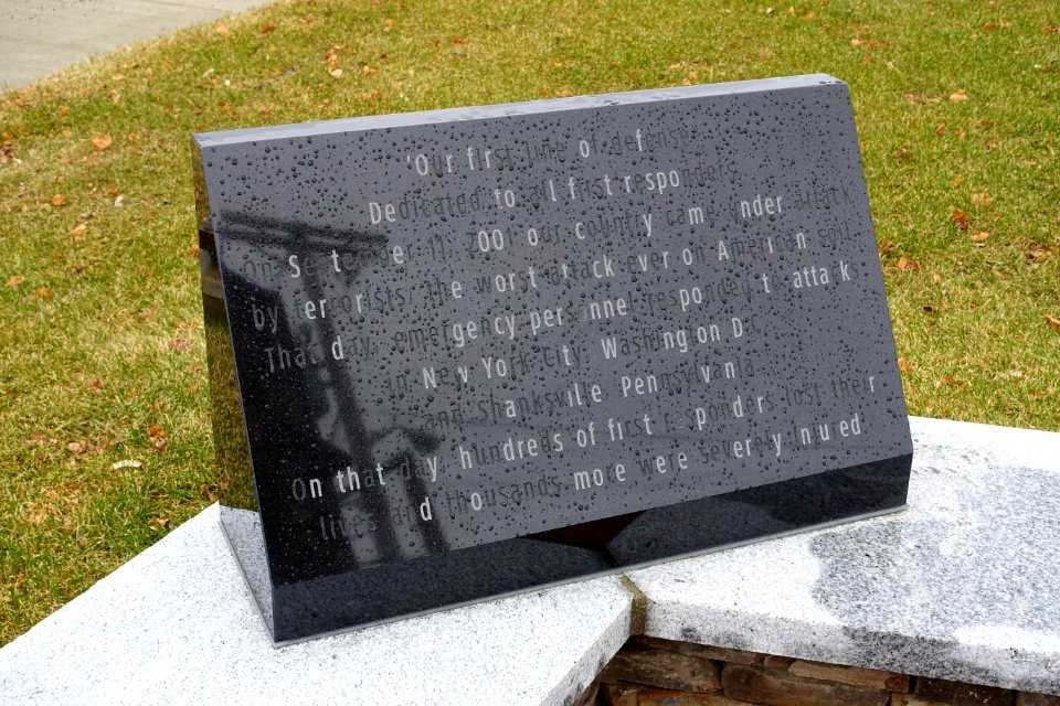 9-11_Memorial_inscription_(Our_First_Line_of_Defense)_-_Westborough,_Massachusetts_-_DSC04921