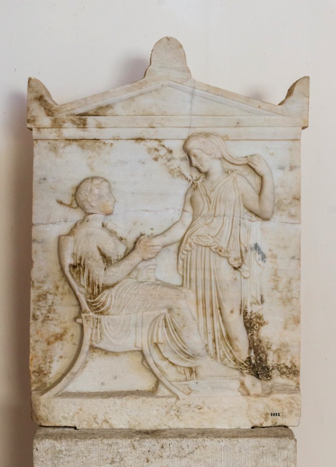 Aegina_funerary_relief_rich_style_dexiosis_5th_century_BCE