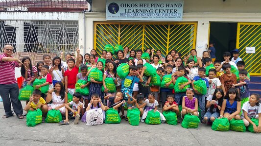 Oikos helping hand philippines singapore