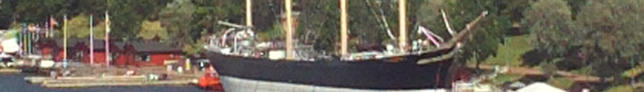 Aland banner Sailing ship in harbour
