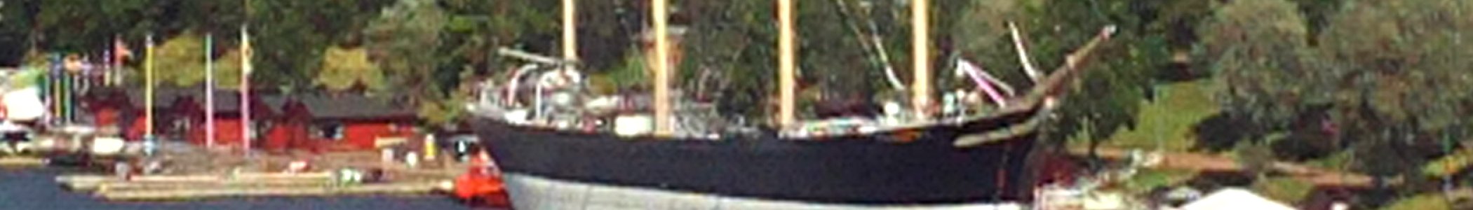 Aland banner Sailing ship in harbour