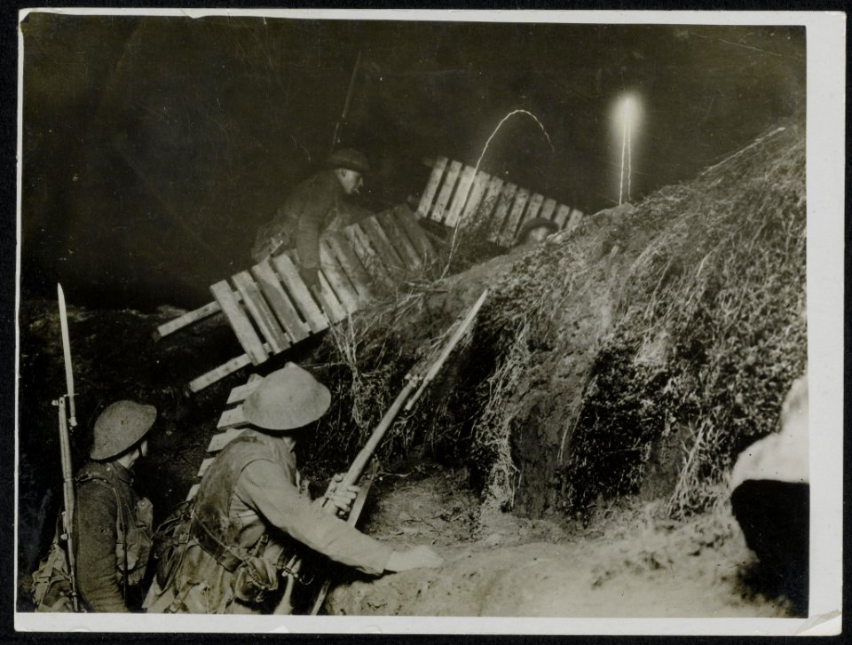 A working party carrying chick-boards over a support line trench at night., Bestanddeelnr 158-1453