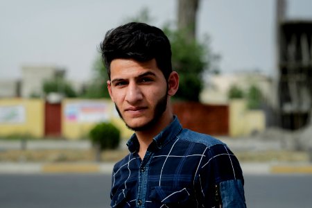 A young Moslawi gentleman poses for a portrait in summer of 2019 in Mosul