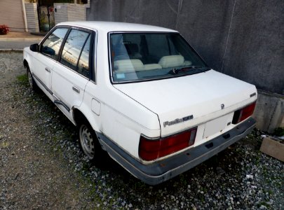 Abandoned Mazda Familia Sedan XE (BF) rear
