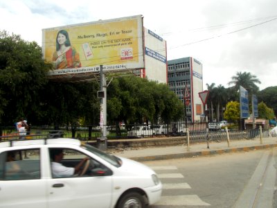 An Advertisement about various silks beside silk board