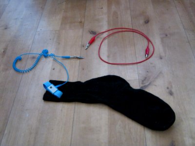 An ESD band with a crocodile clip and a sock