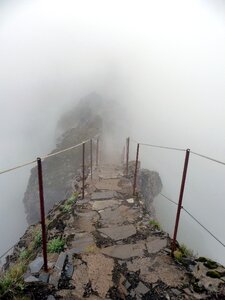 Mystical mountains way in the fog