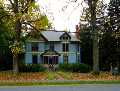 Amherst Massachusetts house with trees and leaves in early autumn