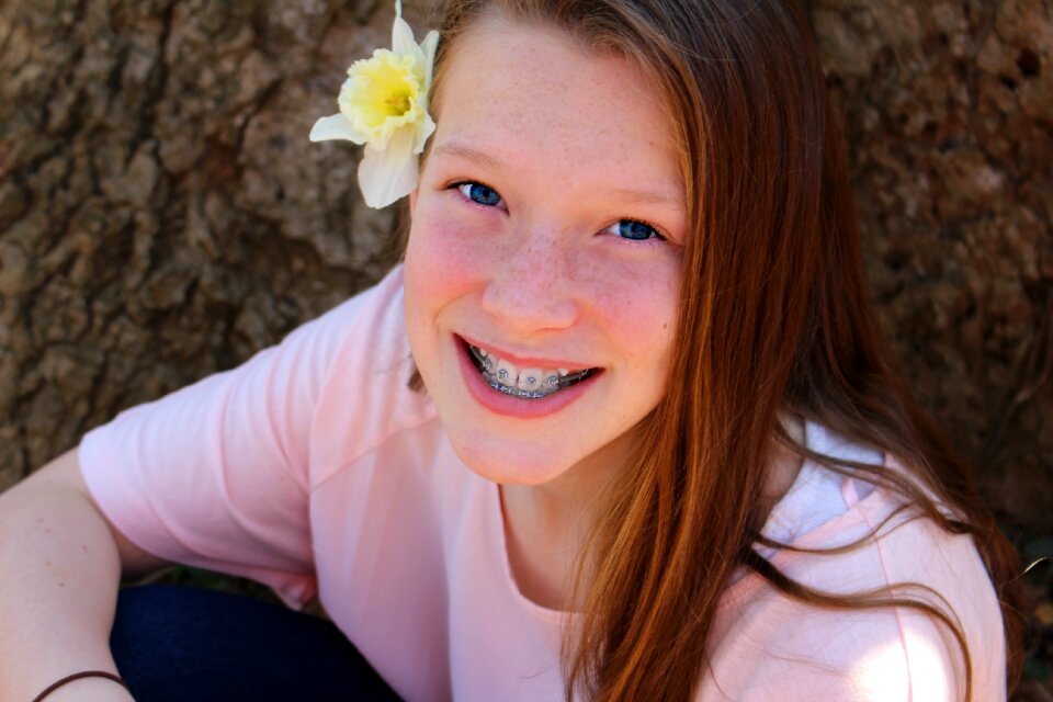 Young beautiful smile grass