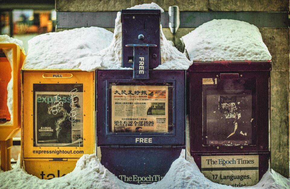 Snow covered news stand news