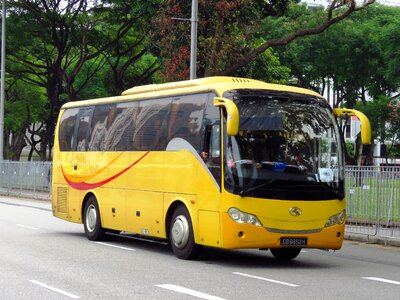 Yellow bus city road photo