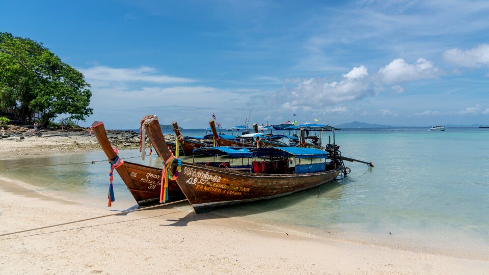 Beach wooden boats sea photo