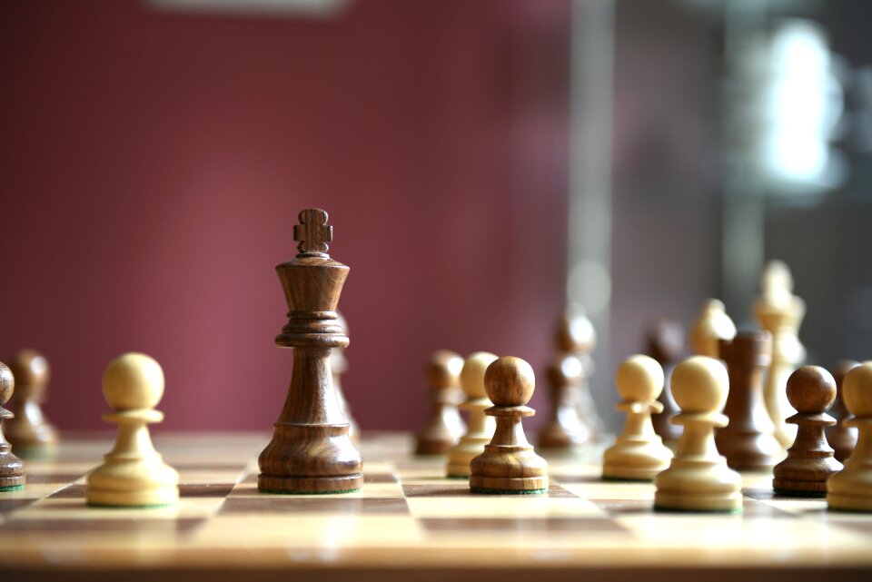 Wooden figures chess board chess pieces photo