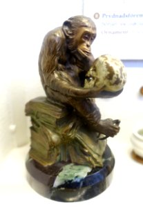Ape on a pile of books, with inscription Eritis sicut deus, N. Herx & Sohne, Wiesbaden, Germany, late 1800s, bronze - Nordiska museet - Stockholm, Sweden - DSC00036