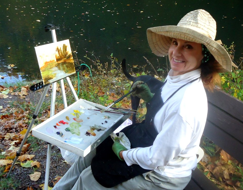 Artist Emma Auriemma painting at Echo Lake Park in Mountainside New Jersey