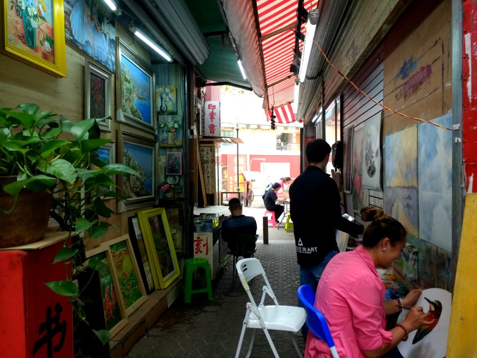 Artists at work in Dafen Oil Painting Village