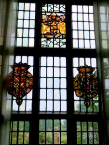 Arms of Queen Elizabeth I, 1500-1599, and Thomas Radcliffe, 3rd Earl of Sussex and Thomas Howard, 1st Earl of Suffolk, date unknown, stained glass and lead - Packwood House - Warwickshire, England - DSC08808