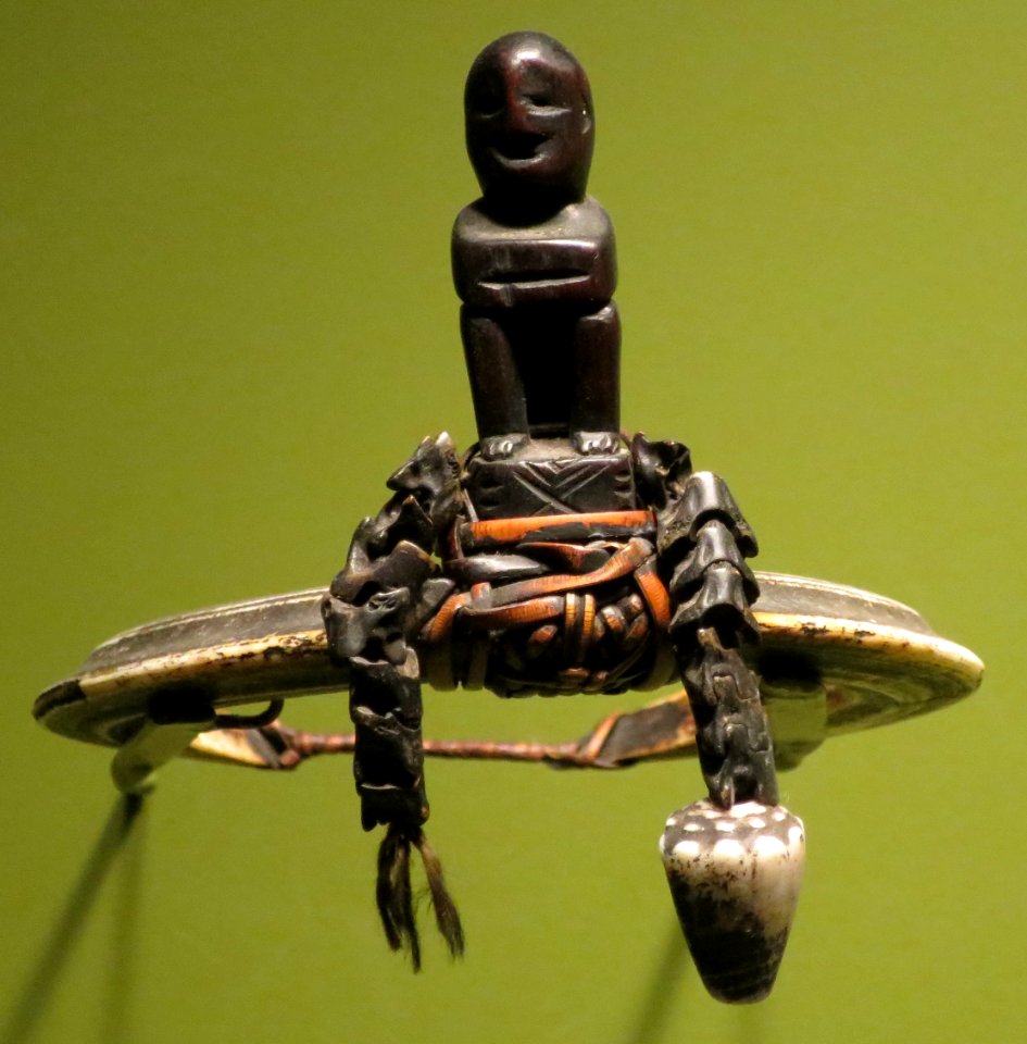 Arm band from Kankanay, Northern Luzon, boars tusks, wood, animal teeth, raffia ties, shell, Honolulu Museum of Art