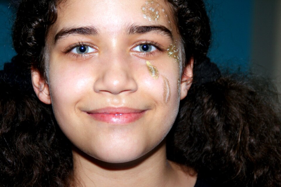 Face painting green eyes smile