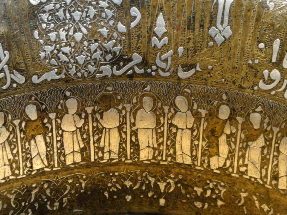Basin with Christian and Islamic motifs, probably northern Iraq, mid 13th century AD, brass inlaid with silver, view 3 - Freer Gallery of Art - DSC05384