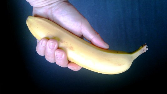 Banana in hand photo
