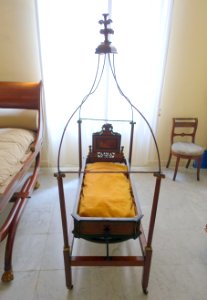Baby cot, Catalonia, c. 1820 AD, mahogany, gilded brass - Museo Nacional de Artes Decorativas - Madrid, Spain - DSC08461