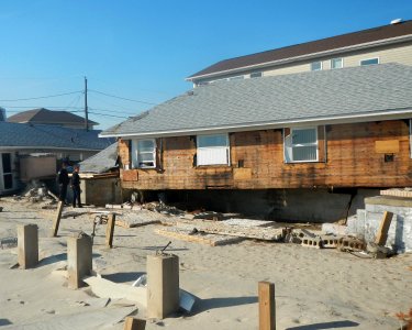 B217 beach houses shoved off piers Sandy jeh photo