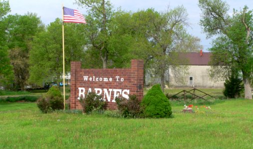 Barnes, Kansas welcome sign and kingpost bridge 1