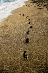 Footsteps sea beach photo