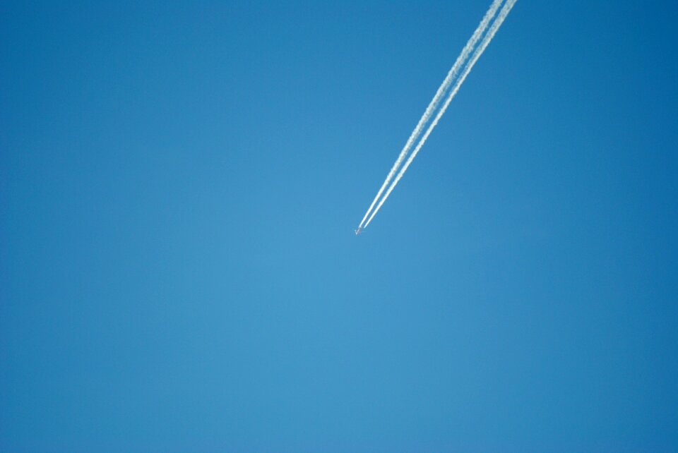 Blue flying partly cloudy