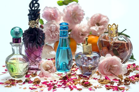 Perfume bottles fragrance rose petals photo