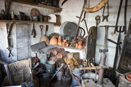 Terracotta pots galvanised metal buckets gray tools
