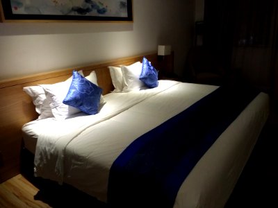 Bed at Tianhe Hotel in Shenzhen