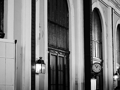 Clock street lamp black and white photo