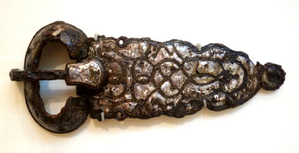Belt Buckle with Rounded Triangular Plate, Frankish (Burgundian), 7th century, iron, silver, copper-alloy inlays, lent by Metropolitan Museum of Art - Chazen Museum of Art - DSC01936