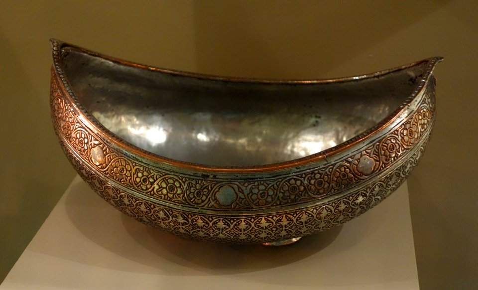 Begging bowl on a wavy, raised foot with interlocking foliate motif, Iran, Qajar dynasty, 18th century AD, gilt copper - Huntington Museum of Art - DSC05046