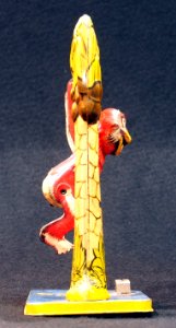 Bombo, tin toy monkey in tree, pic 4