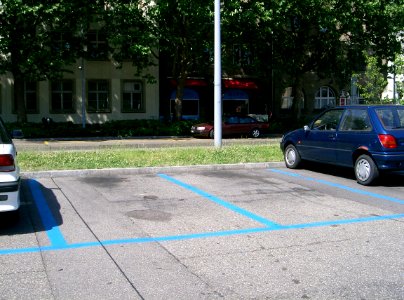 Blue Disc Parking Area Markings Blue Paint photo