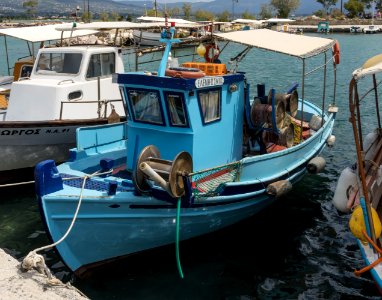 Blue fishing boat harbour Eretria Euboea Greece
